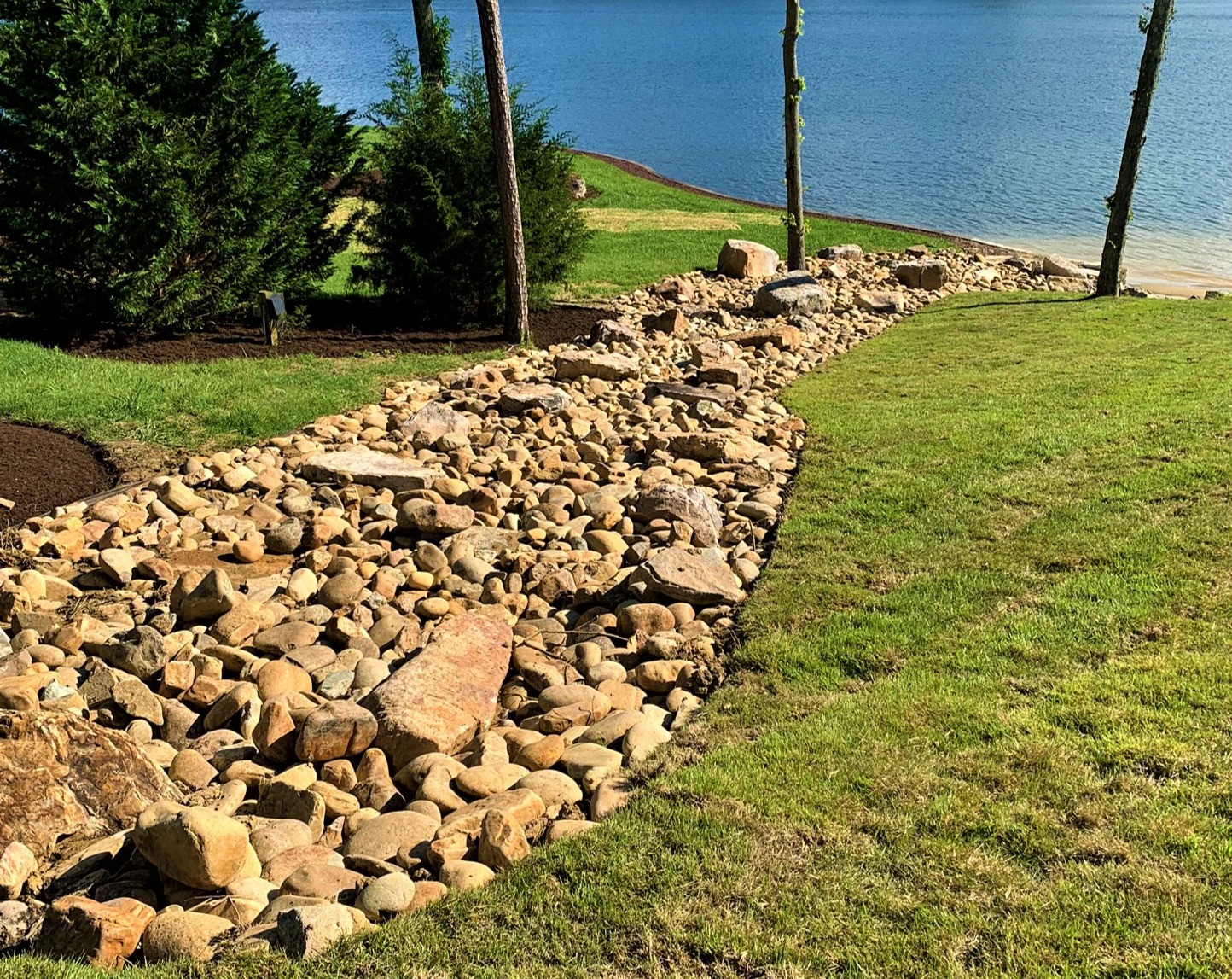 Aesthetic And Functional: How A Dry Creek Bed Can Solve Drainage ... throughout Dry Creek Bed Landscaping