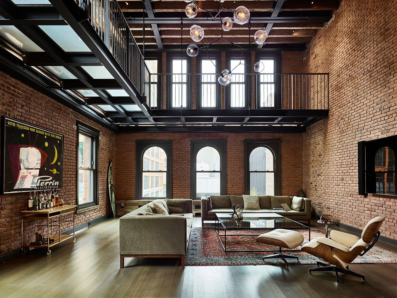 Living Area With Lots Of Exposed Brick Sits Beneath A Metal Catwalk In ... intended for Why Exposed Brick and Steel Remain the Heart of Urban Loft Aesthetics