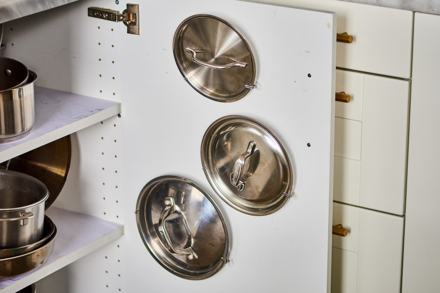 Pot Lid Command Hook Hack - Cabinet Trick | Kitchn regarding Pot Lid Organizer Cabinet