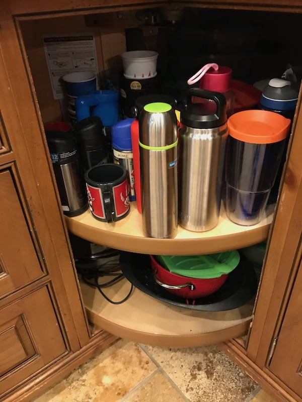 Smart Ways To Organize Water Bottles In The Kitchen - Streamlined Living within Water Bottle Organizer Kitchen