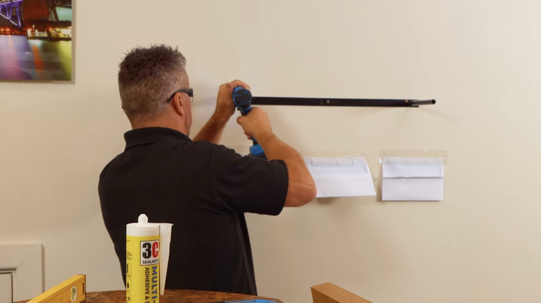 The Property Brothers-Approved Trick For Perfectly-Hung Floating Shelves throughout Install Floating Shelves On Drywall