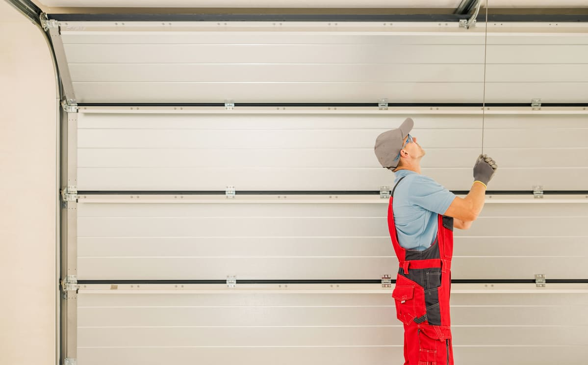 How To Spot A Damaged Garage Door Before It Breaks | Imgdr in Why your garage door makes that awful noise and how to fix it before it breaks